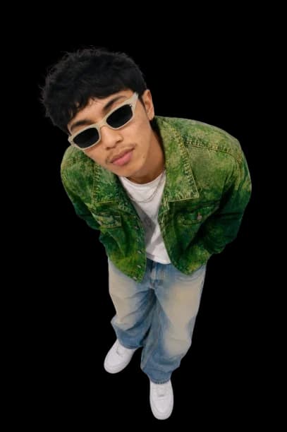 Farkhan Nabiel Makarim, looking toward the camera in a green jacket
